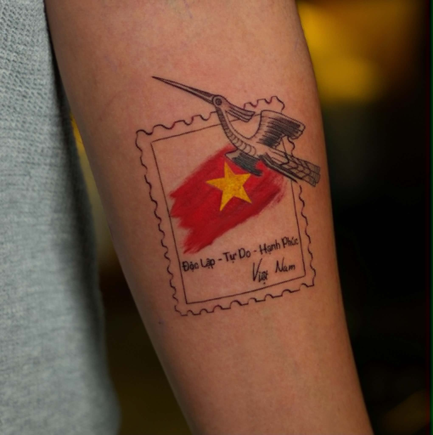 Soho featured tattoo 4 — Vietnam postage stamp and bird